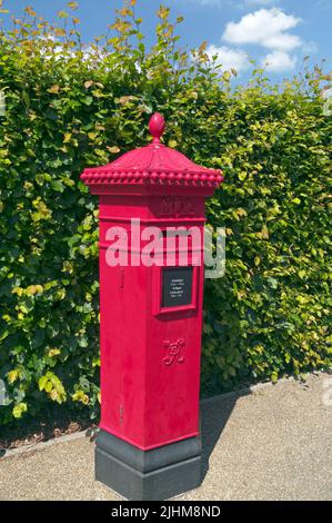 Victorian red pillar box post box at St Fagans Museum, Cardiff. Summer 2022. July Stock Photo