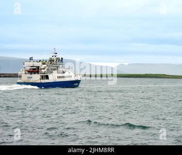Reykjavík, Iceland - July 5, 2022 Landscape view of Lilja heading to sea. Lilja is a fast-cruising catamaran tour boat built in Norway for Special Tou Stock Photo