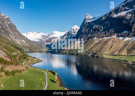 Aerial panoramic view over fjord Hjorundfjord towards village Oye at end of fjord, Norway Stock Photo