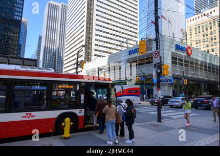 Passengers boarding the 19 Dupont bus in Bay Street, downtown Toronto, Ontario, Canada. Stock Photo