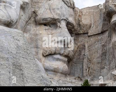 Close-up of Roosevelt sculpture at Mount Rushmore National Memorial in the Black Hills of South Dakota USA Stock Photo