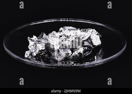 Chromium fragments, industrial use ore, metallic chemical element, isolated on black background Stock Photo