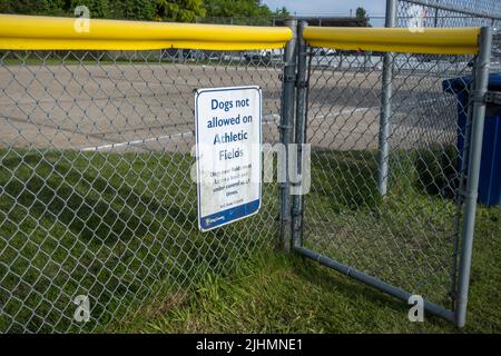 Woodinville, WA USA - circa May 2022: Close up view of a sign discouraging dogs on the athletic field at the Woodinville sports park Stock Photo