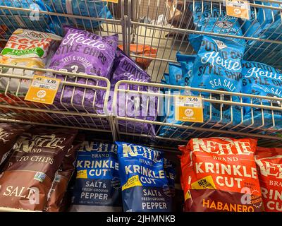 Mill Creek, WA USA - circa June 2022: Low angle view of a variety of kettle cooked chips for sale inside a Sprouts Market. Stock Photo