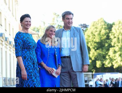 19 July 2022, Bavaria, Oberschleißheim: The President of the Bavarian State Parliament Ilse Aigner (l) stands next to Bavarian Prime Minister Markus Söder and his wife Karin at the defilee for the summer reception of the Bavarian State Parliament at Schleißheim Palace. Photo: Felix Hörhager/dpa Stock Photo