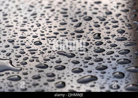 water drops on a black glass surface Stock Photo