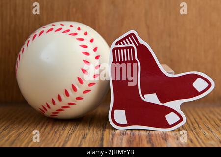 July 19, 2022, Cooperstown, New York. Emblem of the Boston Red Sox baseball club and baseball. Stock Photo