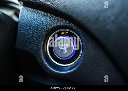 Engine start and stop button in modern car Stock Photo