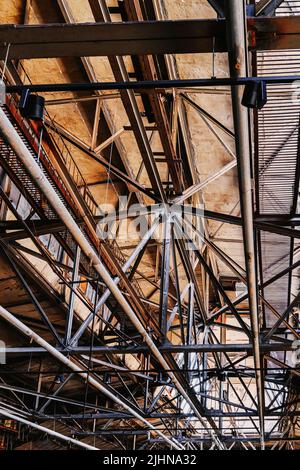 Metal roof construction view from below. Industrial factory building indoor Stock Photo