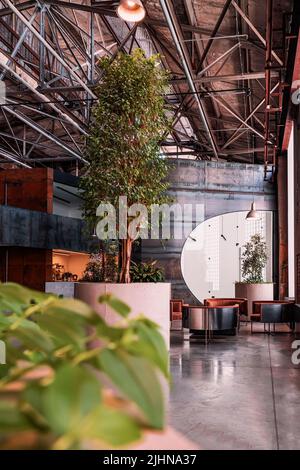 Modern business space, empty meeting rooms and coworking workplaces in industrial design, selective focus Stock Photo