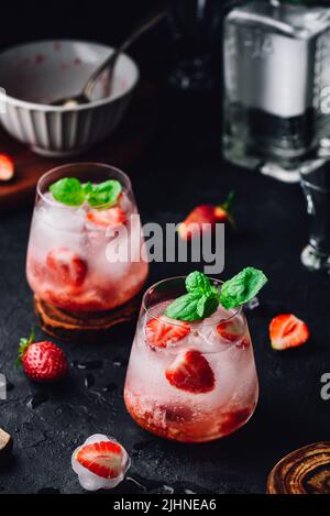 Cocktail with fresh and frozen strawberries, gin and tonic Stock Photo