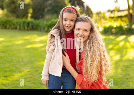 Image of happy caucasian mother and daughter in garden Stock Photo