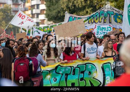 Milan, Italy. 02nd Oct, 2021. Sign: ' Whatever it takes to save humanity - act now '. On October 2nd, 2021 on the occasion of the Youth COP and Pre COP 26 6000 people joined a Fridays for Future school strike in Milan, Italy. They protested to show a clear message for climate and environmental protection, for the Paris Agreement & the 1.5 degree goal, and to make pressure on the politicians. (Photo by Alexander Pohl/Sipa USA) Credit: Sipa USA/Alamy Live News Stock Photo