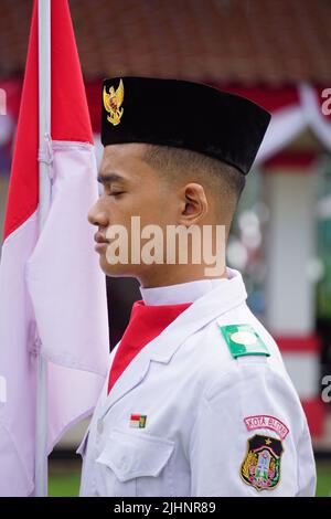 Paskibraka (Indonesian flag raiser) with national flag during grebeg pancasila Stock Photo