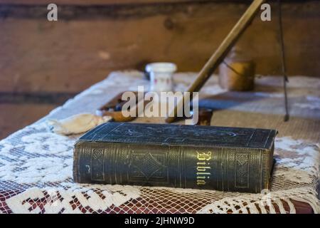 Old leatherback bible on the table at Amuri Museum of historic Housing in Tampere Finland Stock Photo