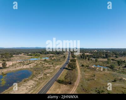Drone aerial view looking down over sapphire mine diggings in central Queensland Australia. The road between Sapphire and Rubyvale. Stock Photo