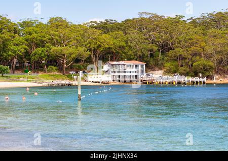 Beach, restaurant and bar on the Little Beach foreshore - Nelson Bay, NSW, Australia Stock Photo