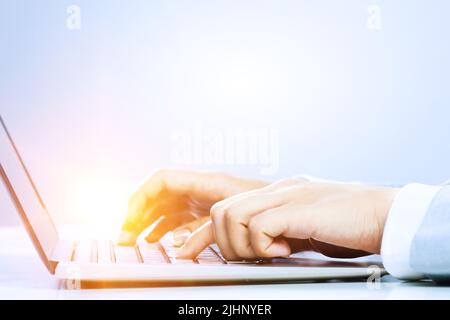 Hands of a young woman on keyboard Stock Photo