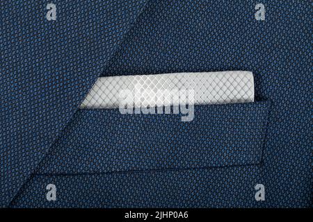 Close up picture of a blue suit with a  gary tissue in it Stock Photo
