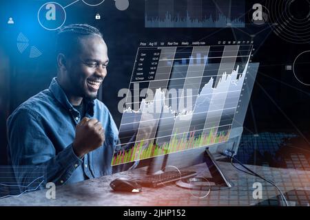 Successful Stock Market Trader Looking At Screen In Office Stock Photo