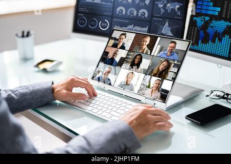 Virtual Business Video Conference On Hybrid Laptop Stock Photo