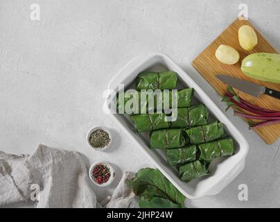rolls with beet leaves squash and potatoes. A Vegetarian Cooking, top view, copy space Stock Photo