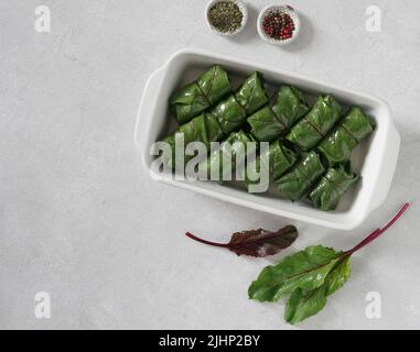rolls with beet leaves . A Vegetarian Cooking, top view, copy space Stock Photo
