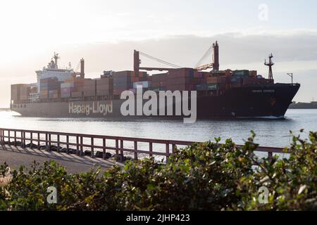 Container Ship entering Durban Port on a July winter morning. Stock Photo