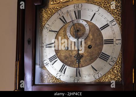 Vintage grandfather clock deal with Roman numerals. Close-up photo Stock Photo