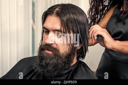 Refreshing affect. hair wash and care. new stylish haircut. mature hipster with beard. Stock Photo