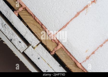 House insulation layers, styrofoam, polyurethane foam, wood, drywall ...