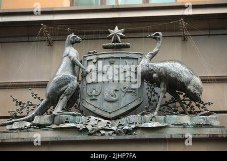 Sydney, Australia - 19 July 2022. A sculpture of the Australian coat of arms in the rain. The sculpture sits on the front of the old Commonwealth Bank. Stock Photo