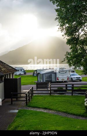 Evening sunlight setting over the mountains,Bunree Campsite, Onich, Fort William, Scotland, UK. Stock Photo