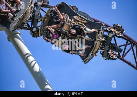 Thrill seekers on 'The Ride To Happiness', a large roller coaster at Plopsaland in Belgium. Stock Photo