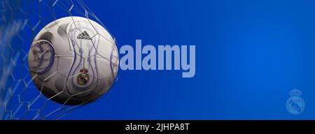 Guilherand-Granges, France - July 20, 2022. LaLiga santander of Spain. Soccer ball in net with official logo of Real Madrid. 3D rendering. Stock Photo