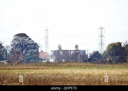 The scene after a blaze in the village of Wennington, east London after temperatures topped 40C in the UK for the first time ever, as the sweltering heat fuelled fires and widespread transport disruption. Picture date: Wednesday July 20, 2022. Stock Photo