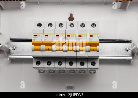 Protective electric devices on a din rail. Stock Photo