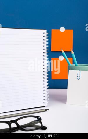 Important Message Written On Notebook On Desk With Cup With Pencils, Notes And Glasses. Crutial Informations Presented On Notepad On Table With Memos Stock Photo