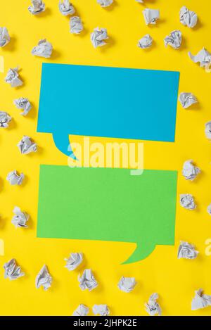 Paper Wraps Placed Around Two Speech Bubbles With Important Informations. Wrinkled Notes Arranged All Over Different Dialogue Ballons With Crutial Stock Photo