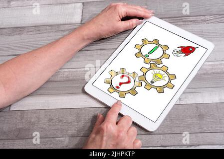 Problem solving concept shown on a tablet used by a woman Stock Photo