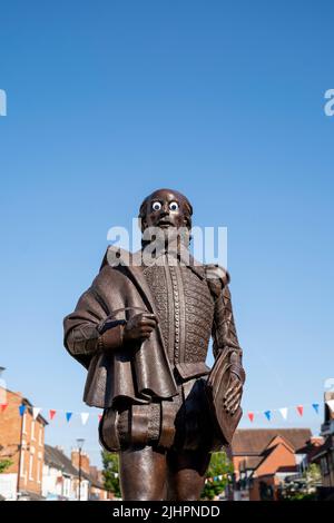 The William Shakespeare statue in Stratford-upon-Avon, West Midlands, England, UK. The statue has had large goggly eyes stuck on his face as a prank. Stock Photo