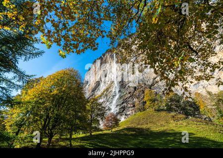 The Lauterbrunnen valley, village of Lauterbrunnen, waterfalls and the Lauterbrunnen Wall in Swiss Alps, Switzerland Stock Photo