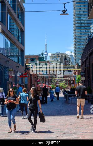 Visitors and tourists walking along Tank House Lane in Distillery District, a major attraction in Toronto, Ontario, Canada. Stock Photo