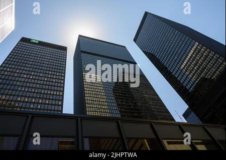 Looking up at the Toronto Dominion (TD) buildings with neighbouring skyscrapers reflected in the glass facades in financial district Toronto, Canada. Stock Photo