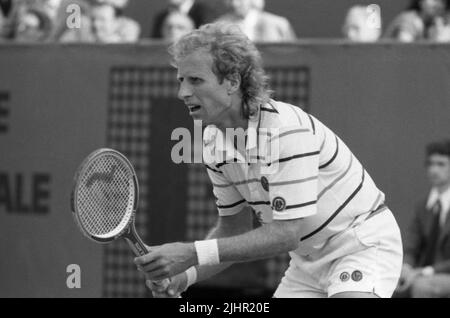 Tennis player Vitas Gerulaitis eats a pickle at a party at the Ala