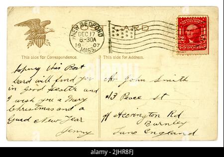Reverse of original Edwardian era American Christmas postcard , good example of 2 cent George Washington stamp, franked with stars and stripes flag, Eagle design, posted to an address in England,  December 17 1907. Stock Photo