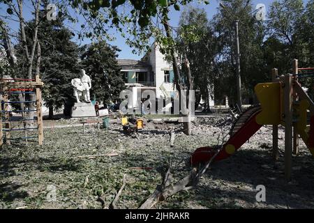 DRUZHKIVKA, UKRAINE - JULY 9, 2022 - The crater from a Russian shell is pictured at a playground, Druzhkivka, Donetsk Region, eastern Ukraine. This ph Stock Photo