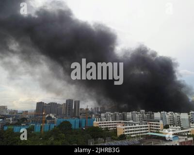 Aerial video taken on July 20, 2022 shows the scene of a fire in an auto parts warehouse in Nanning, Guangxi Province, China. The fire was burning fie Stock Photo