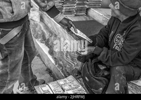 Nepalese rupees in hands of a man exchanging currency in the Kathmandu market, Nepal Stock Photo