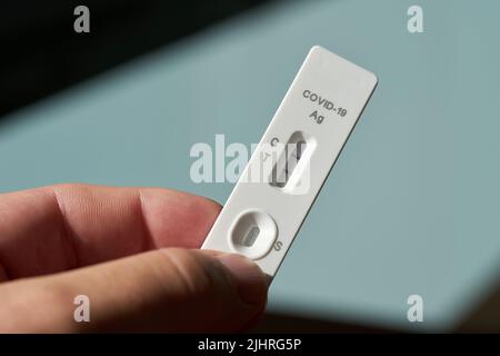 Self-conducted Corona antigen rapid test with a positive test result Stock Photo